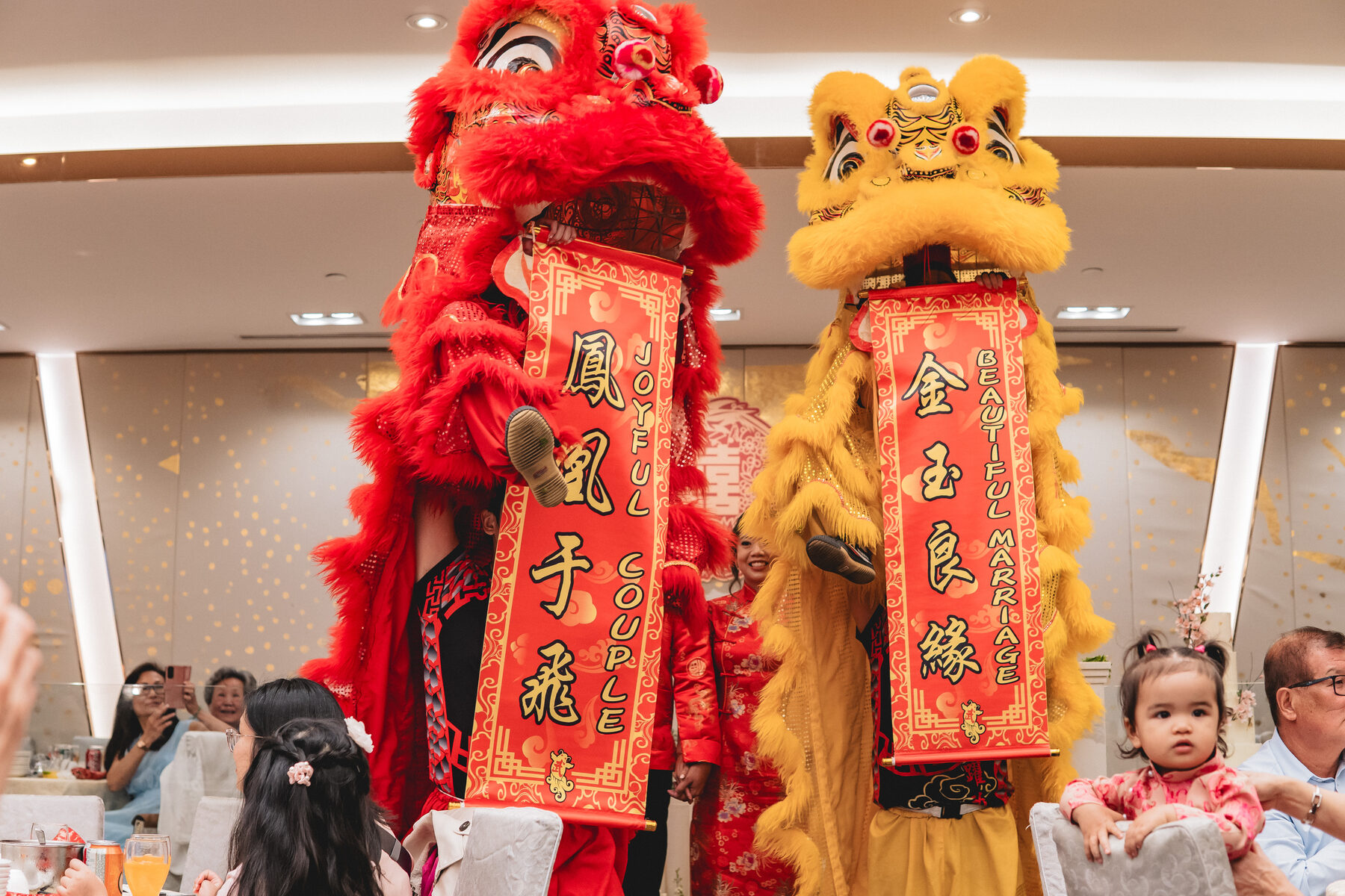 Lion dance performers holding \