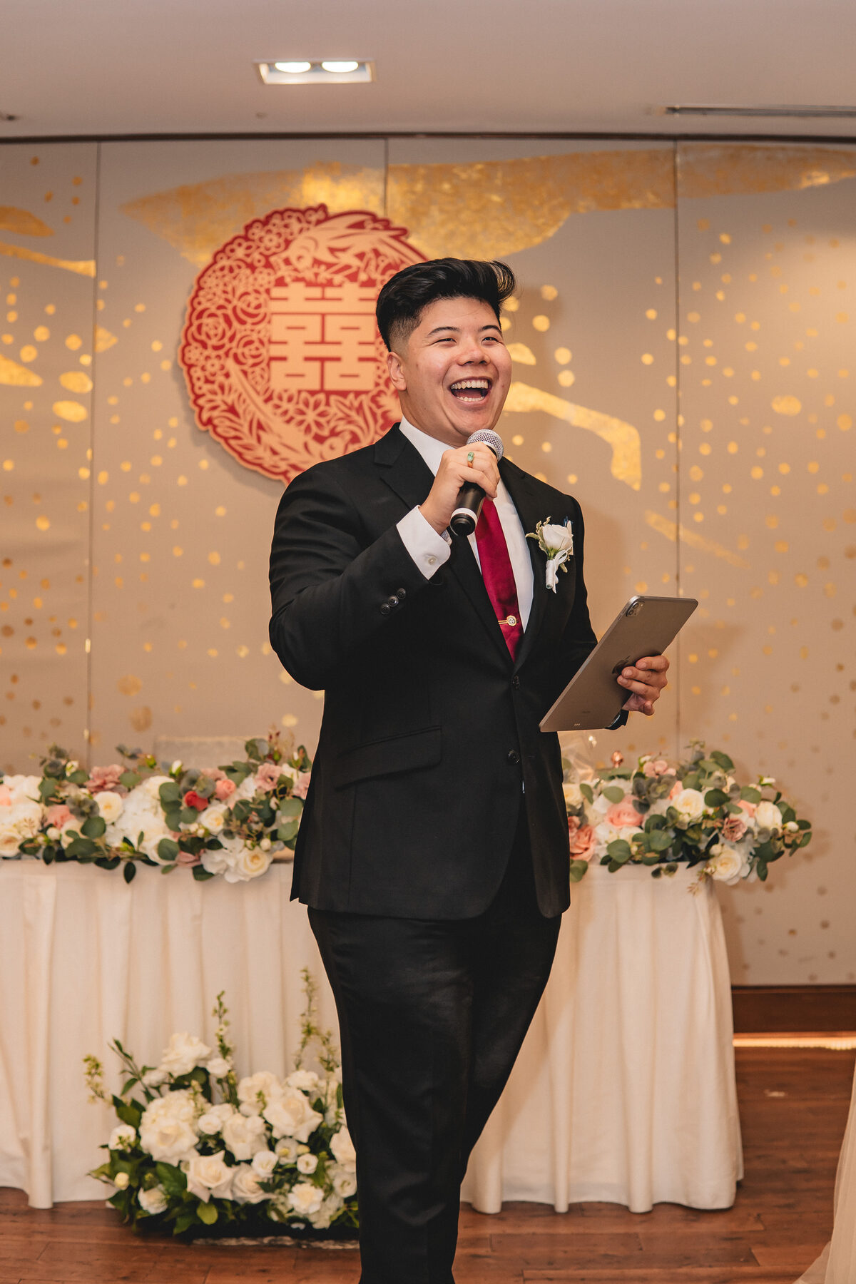 Anthony laughing while hosting Peter & Christine's Toronto reception.