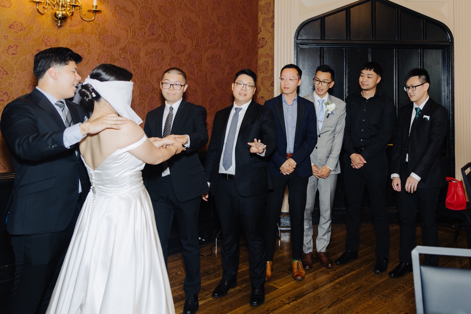 A warm hug between Anthony and a member of the wedding party.
