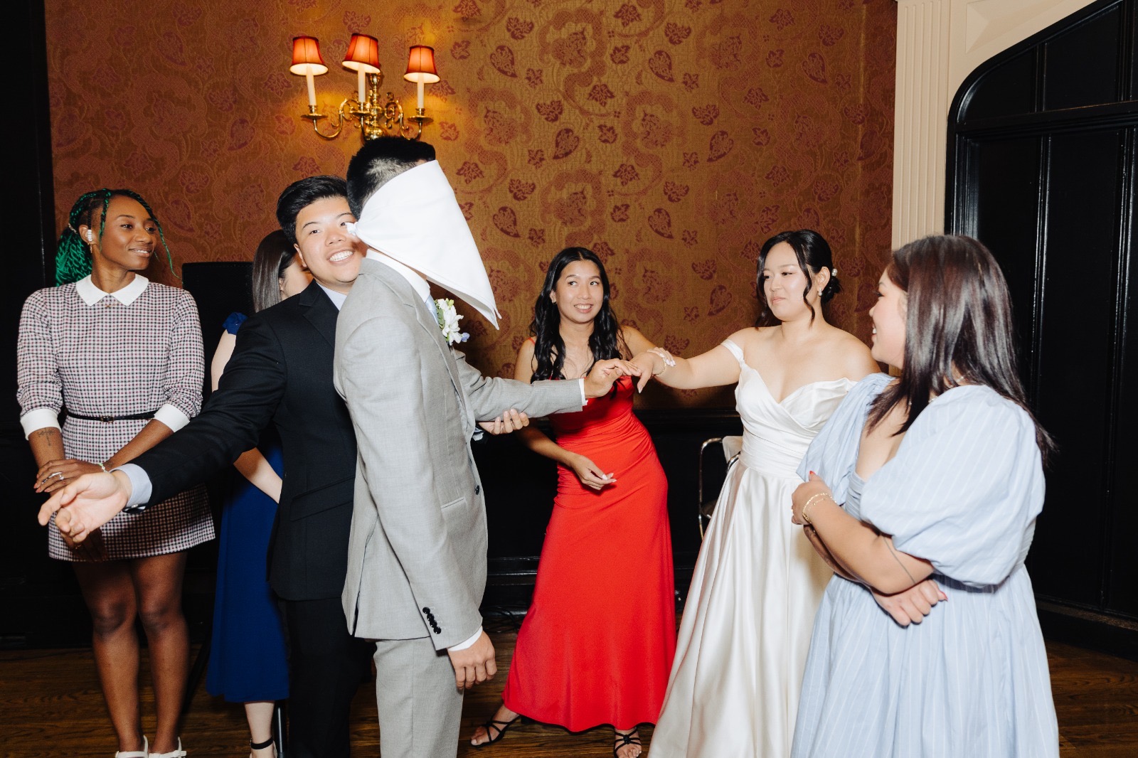 Steven and Esther laughing at the head table during a speech.